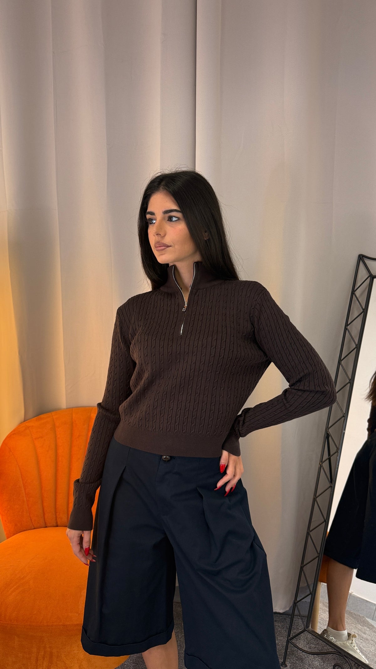 Polo Monique in maglia effetto treccia con zip color nero